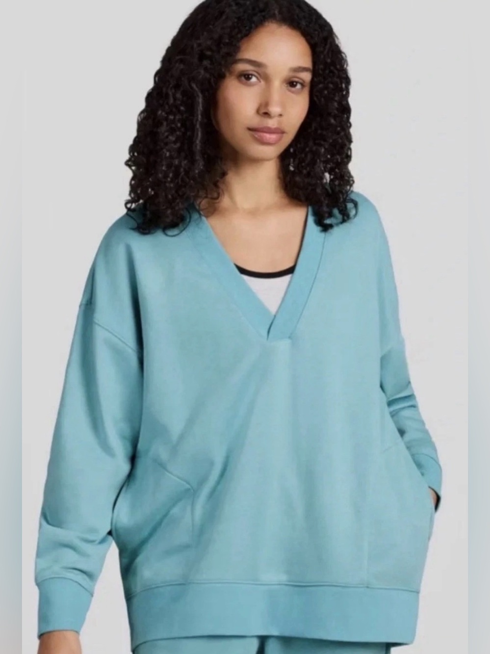 Champion Women’s Long Sleeve V-Neck French Terry Pullover in teal blue